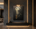 Guru Nanak Dev Ji gold foil canvas wall art with bold Waheguru calligraphy mounted above a modern fireplace
